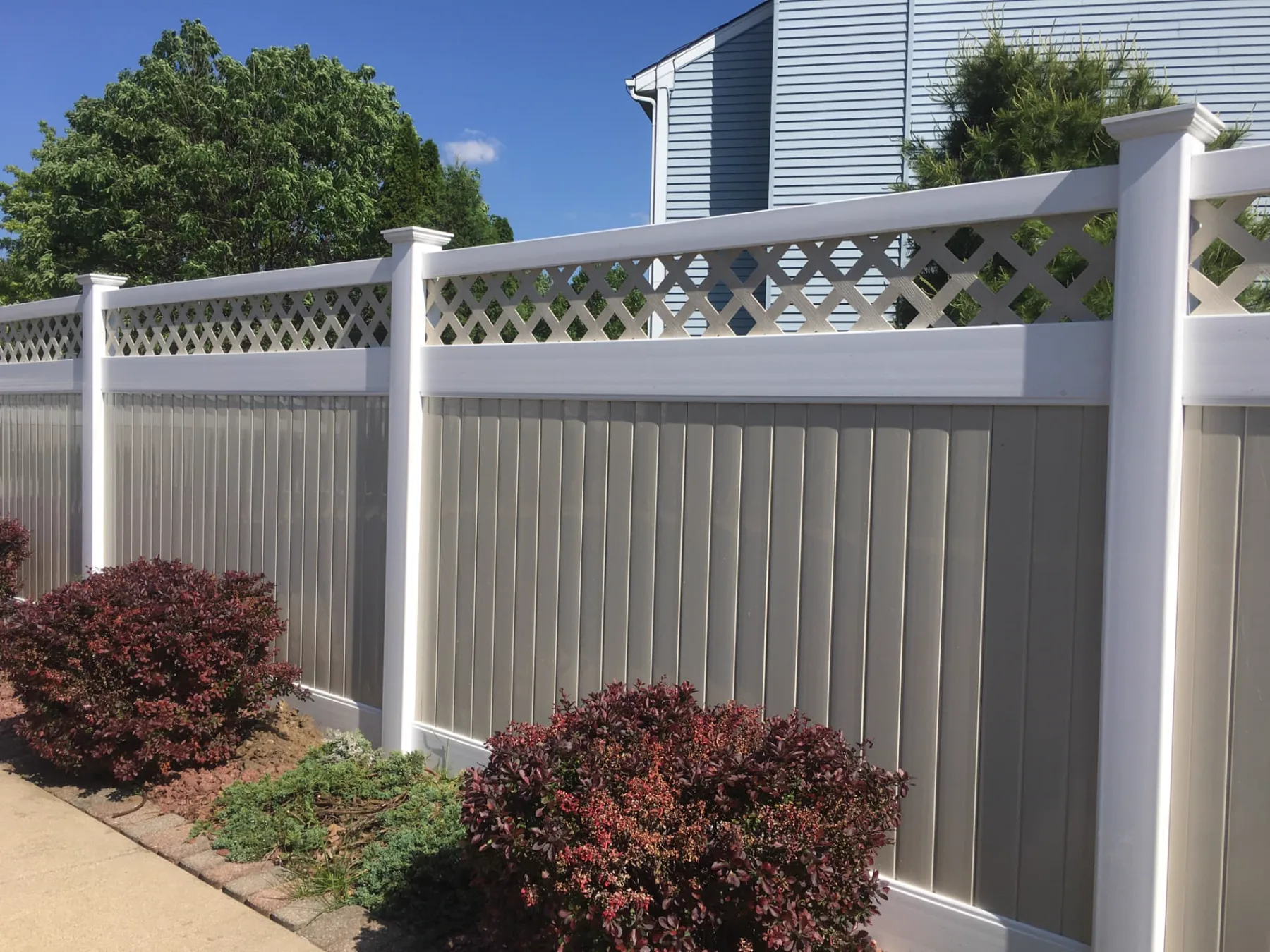 Two-Tone Lattice-Top Vinyl Privacy Fence installed by Cedar Mountain Fence