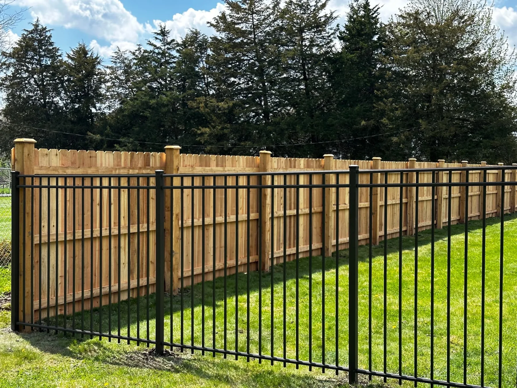 Black Aluminum Fence with Cedar Privacy Fence installed by Cedar Mountain Fence