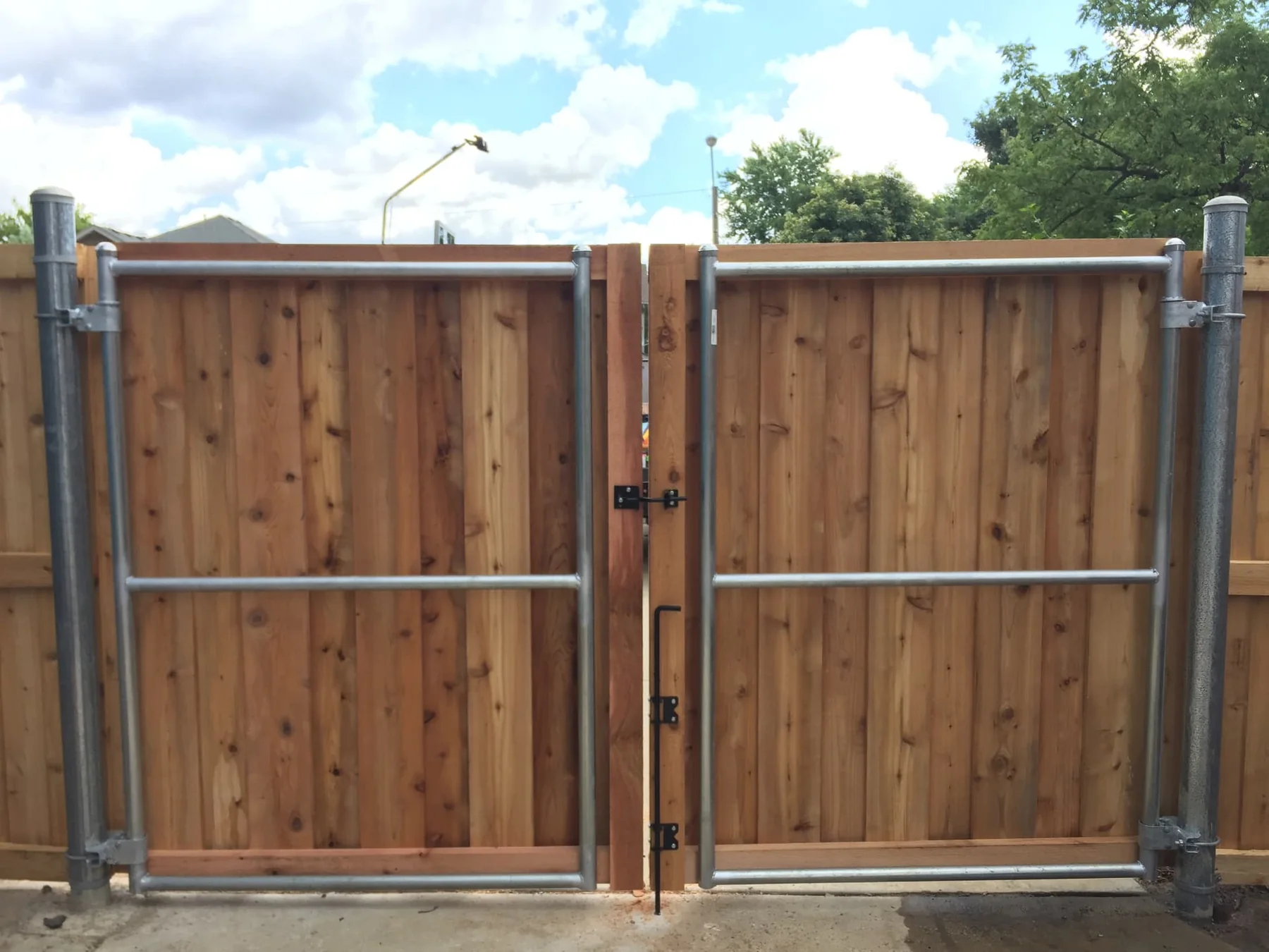 Metal-Framed Cedar Wood Double Gate wood fence installed by Cedar Mountain Fence