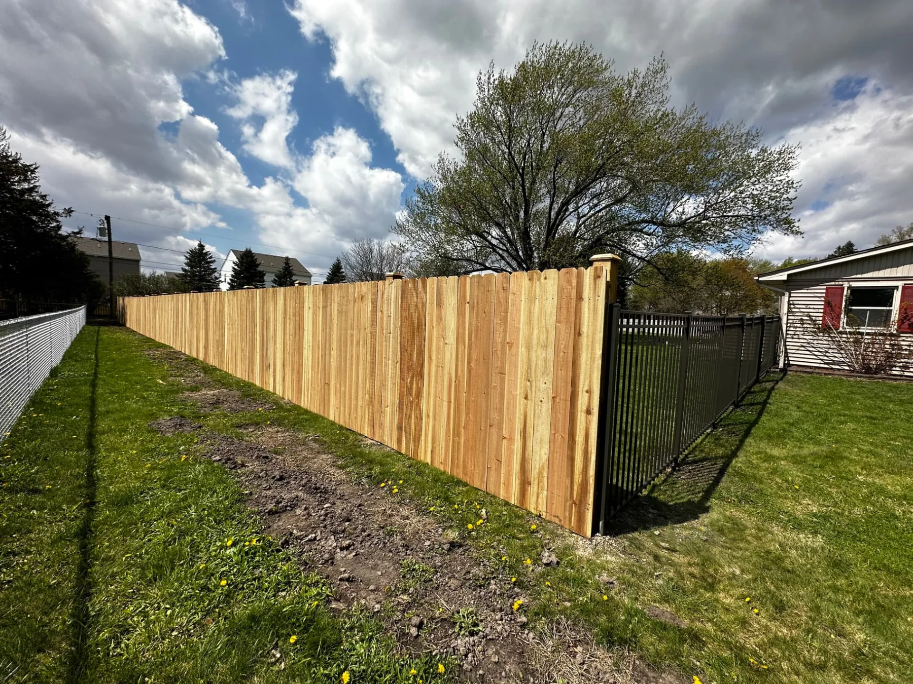 Cedar Wood Fence with Aluminum Accents installed by Cedar Mountain Fence