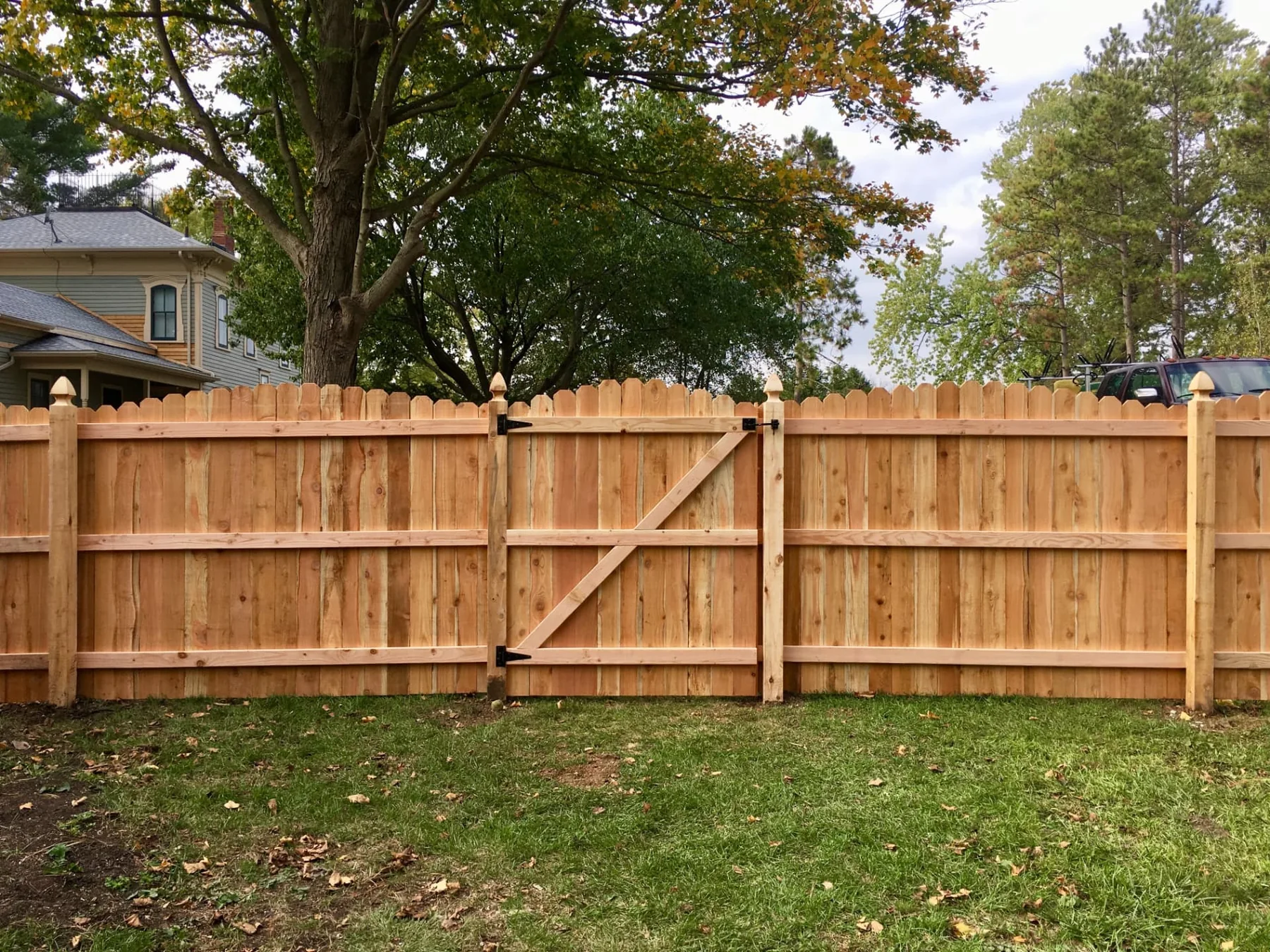 Dog-Ear Wood Privacy Fence with Walk Gate wood fence installed by Cedar Mountain Fence