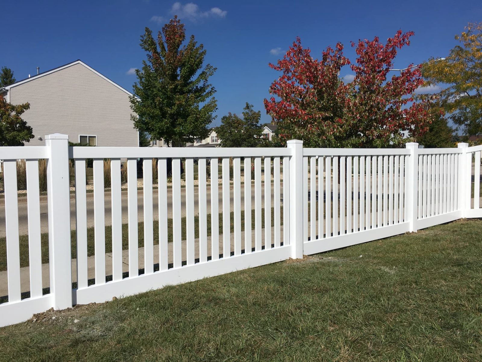 White vinyl picket fence